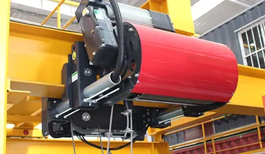 Freshly painted crane drum assembly mounted on a finished girder