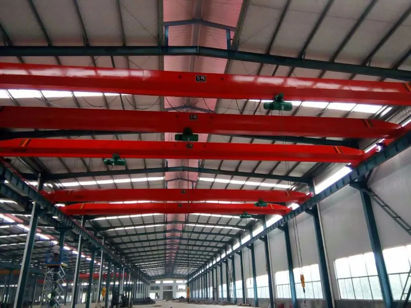 Overhead bridge cranes running the length of the production hall