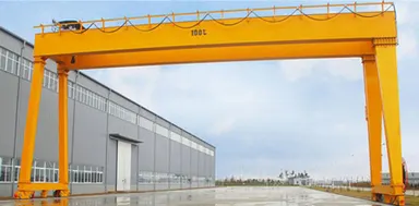 Gantry crane serving an outdoor storage yard beside a distribution warehouse