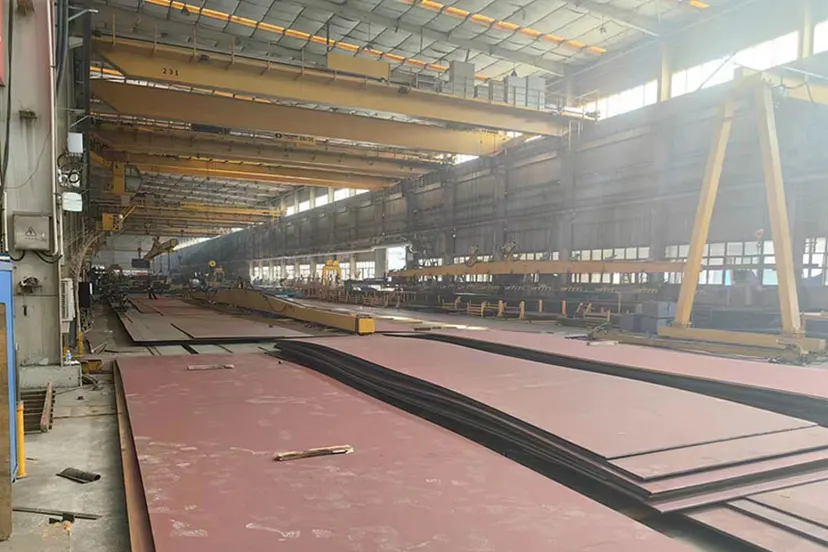 Steel plate and fabricated sections staged in the export packing bay